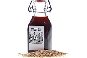 sesame seeds and bottle of sesame oil