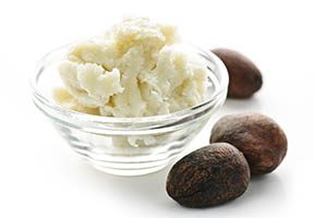 shea butter in bowl with shea fruit