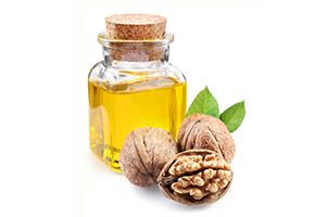 bottle of walnut oil and walnuts