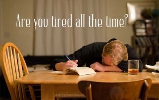 man slumped over desk
