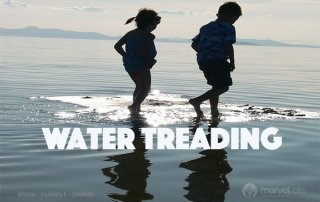 children running in water